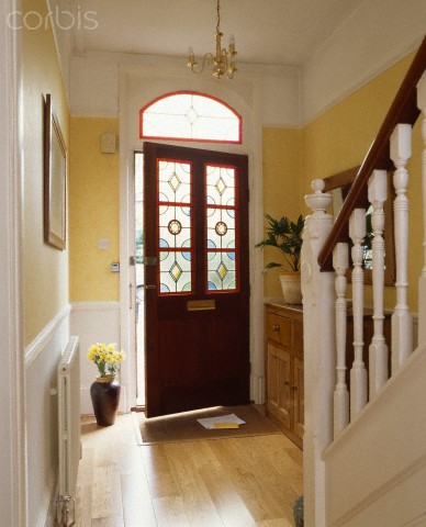 Hallway with front door ajar